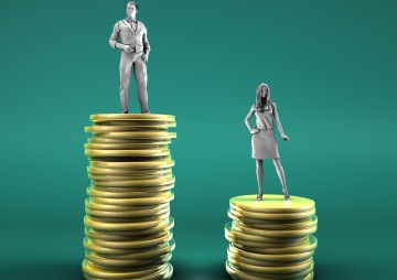 Ilustrace ženského a mužského znaku pohlaví a mince naskládané na sobě